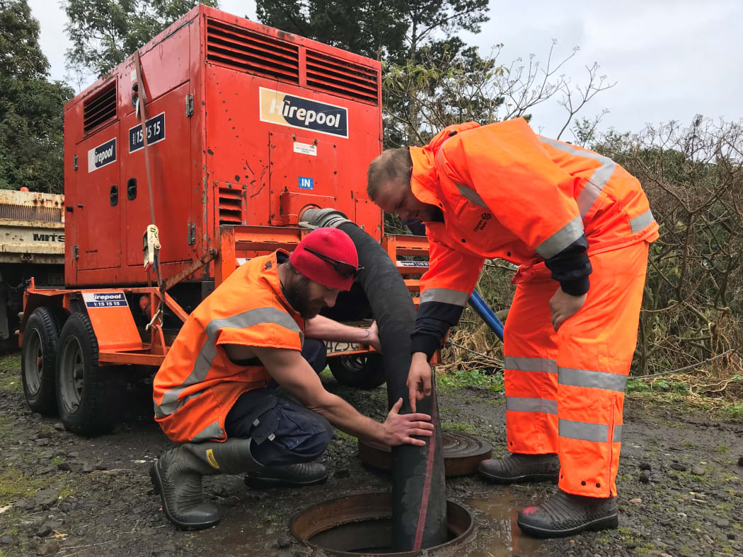 Workers trying to unblock sewer in New Plymouth.
