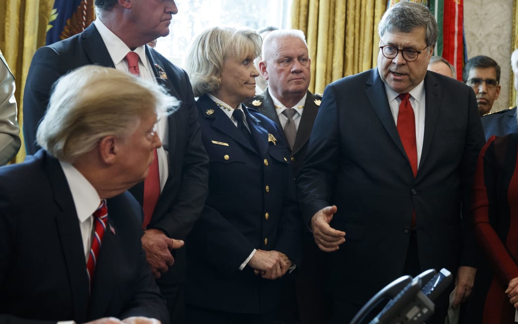 Attorney General Bill Barr speaks to President Donald Trump