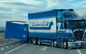 The truck is blocking both lanes at the Tekapo flyover/Tekapo Canal Road intersection.