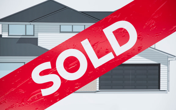 Sold sign outside a new house being built in East Auckland