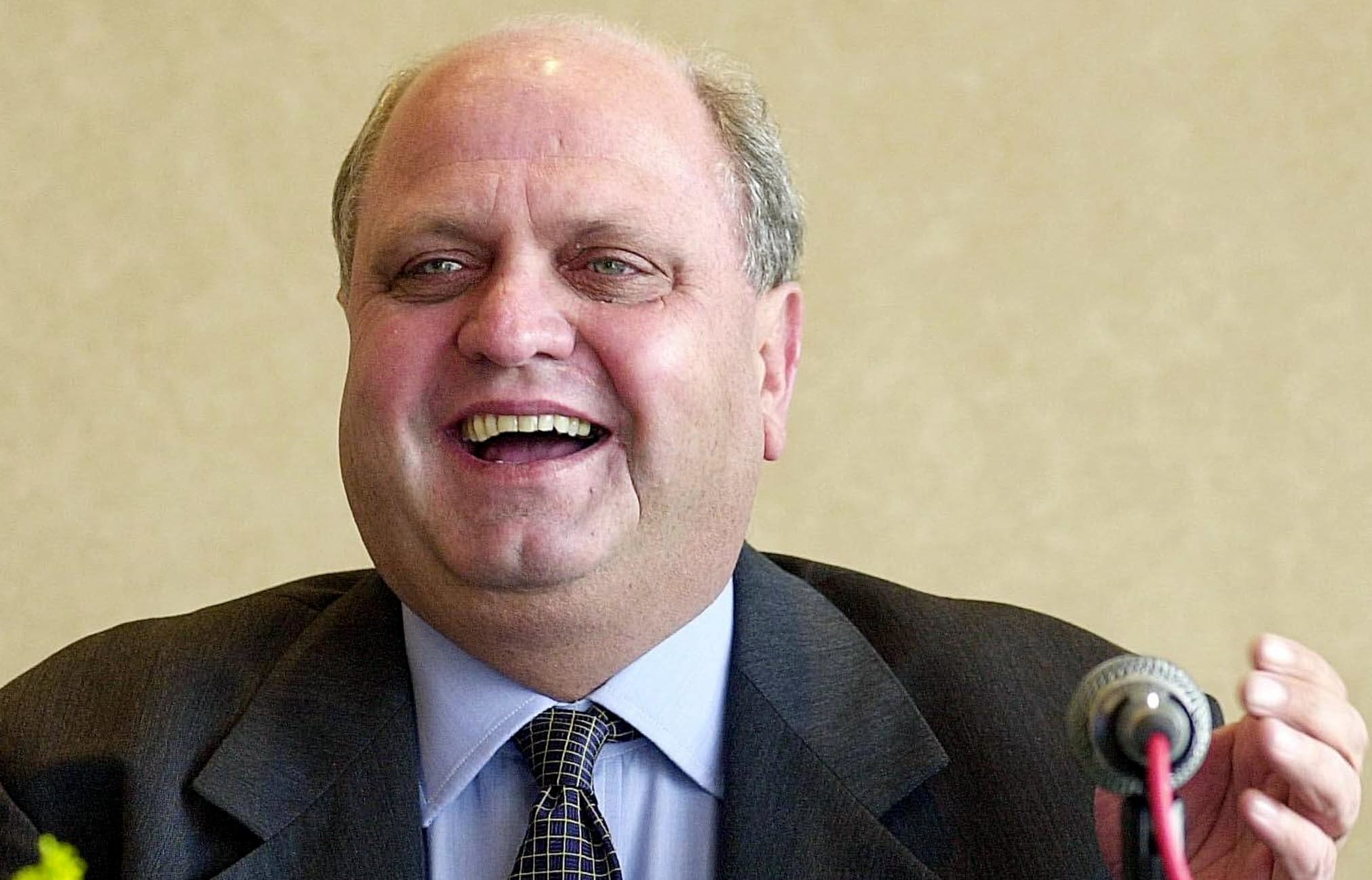 Former World Trade Organisation chief Mike Moore speaks at a press conference 14 February 2000 in Singapore.
