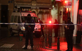 Belgian police officers secure an area in Brussels on Sunday,