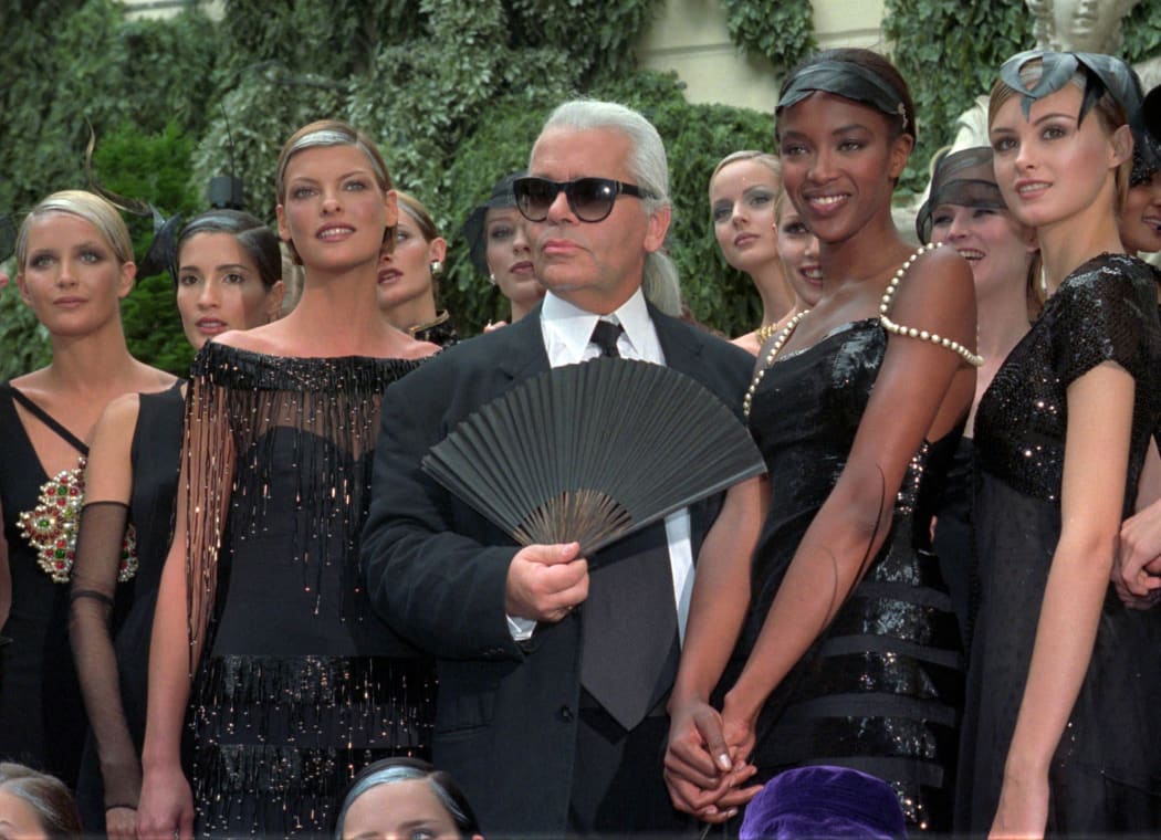 Karl Lagerfeld with Canadian model Linda Evangelista, left, and British model Naomi Campbell, right, and other models after the presentation of his 1996-97 fall-winter haute couture fashion collection for Chanel in Paris.