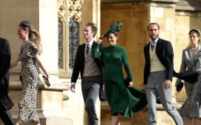 Philippa Matthews Middleton (centre), James Middleton (right), and Pippa's husband James Matthews (left) arrive to attend the wedding of Britain's Princess Eugenie.