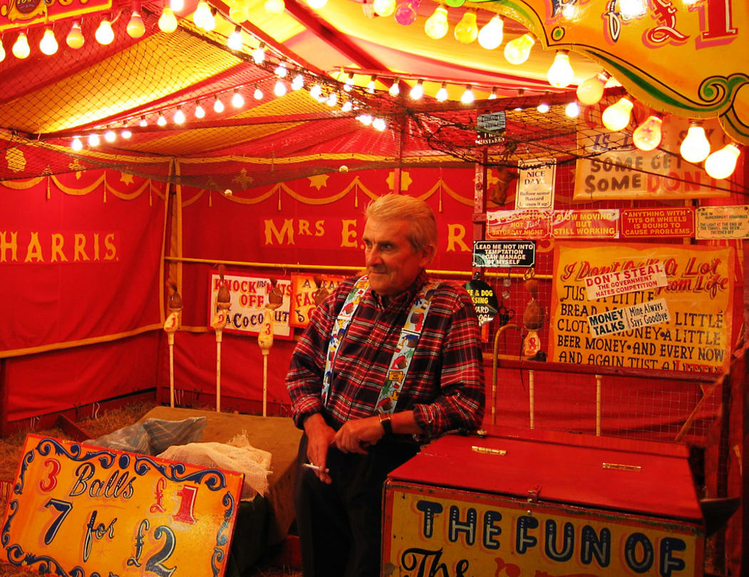 Albert Harris and his coconut shy – Cambridge Midsummer Fair 2005
Albert Harris has been in the fair all his life and runs the Coconut shy established by his mother, Mrs. E. Harris, in 1936.