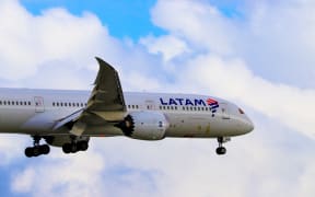 Latam plane landing in Auckland Airport.