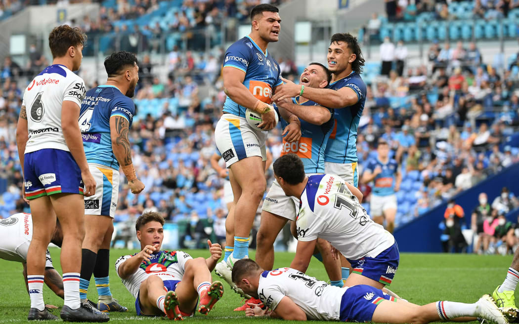 David Fifita of the Titans (centre) reacts after scoring a try during the Round 25 NRL match between the Gold Coast Titans and New Zealand Warriors at CBus Stadium on the Gold Coast, Sunday, September 5, 2021.