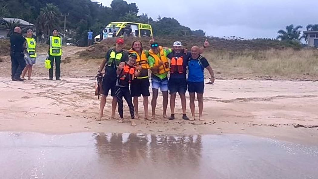 The waka ama crew back on land, after the rescue.