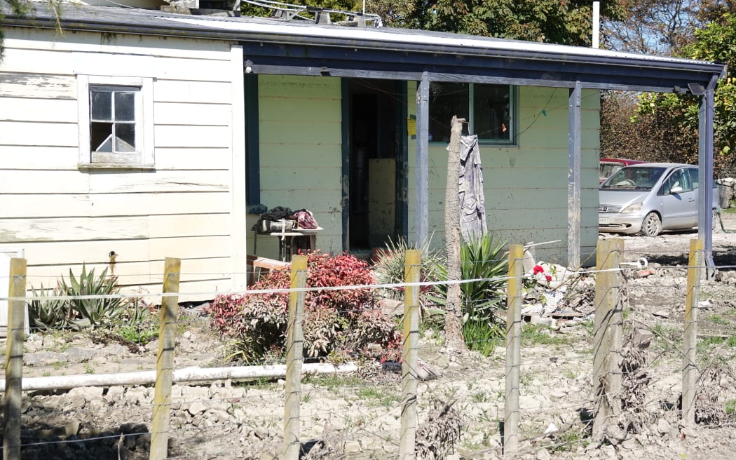 A cottage on Lynley Halpin's property will be pulled down after it was damaged in the flood.