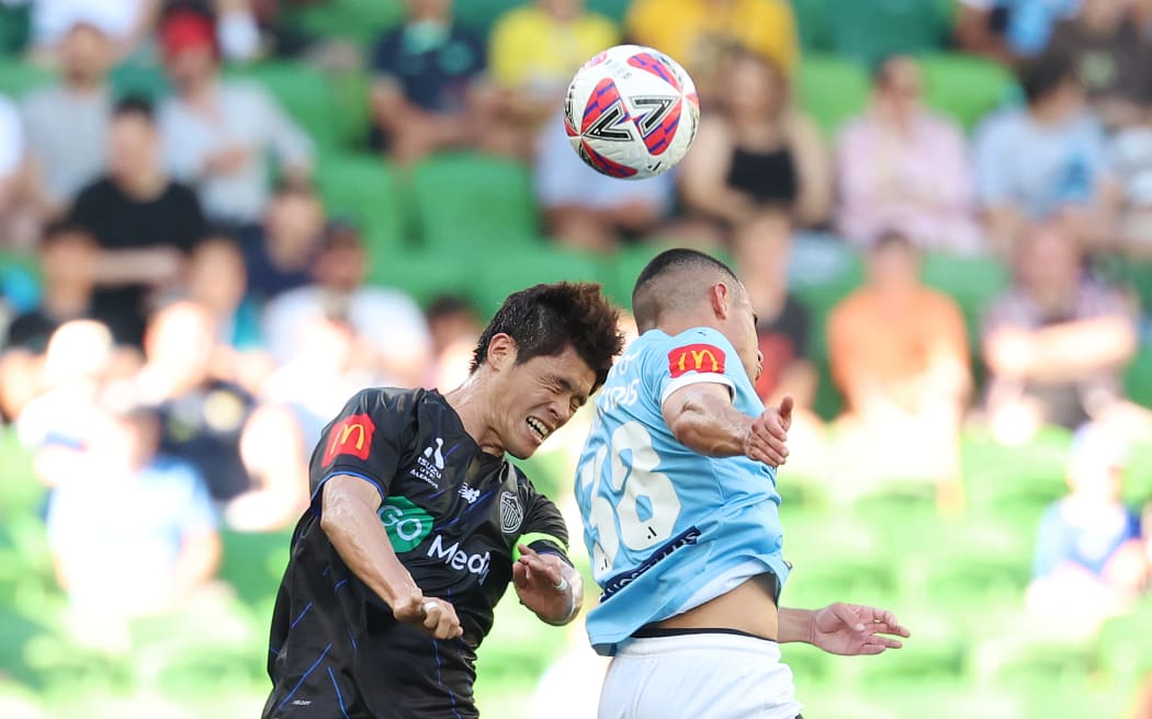 Hiroki Sakai of Auckland FC and Harry Politidis of Melbourne City compete for the ball, A-League 2024.