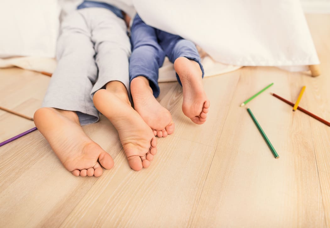 Children sleeping on floor.