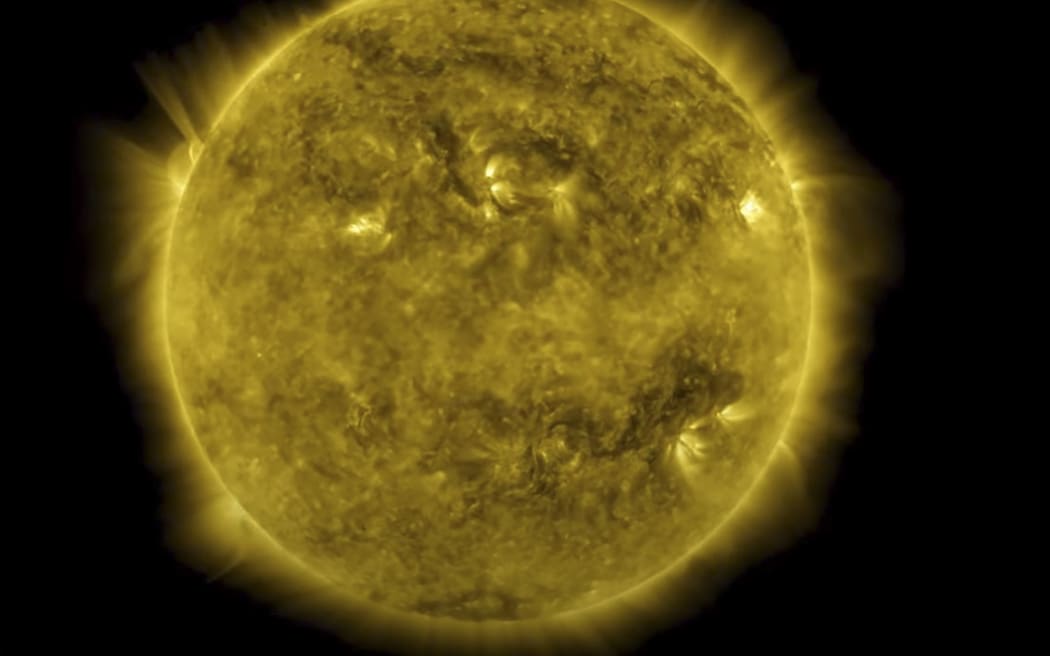 This NASA image obtained July 1, 2020, captured from a video, shows an image from a 10-year time lapse of the Sun at 17.1 nanometers (an extreme ultraviolet wavelength that shows the Sun’s outermost atmospheric layer – the corona) with the rise and fall of the solar cycle and notable events, like transiting planets and solar eruptions. As of June 2020, NASA’s Solar Dynamics Observatory – SDO – has now been watching the Sun non-stop for over a full decade. From its orbit in space around Earth, SDO has gathered 425 million high-resolution images of the Sun, amassing 20 million gigabytes of data over the past 10 years. (Photo by Handout / NASA/GSFC / AFP) / RESTRICTED TO EDITORIAL USE - MANDATORY CREDIT "AFP PHOTO /NASA/GSFC/HANDOUT" - NO MARKETING - NO ADVERTISING CAMPAIGNS - DISTRIBUTED AS A SERVICE TO CLIENTS