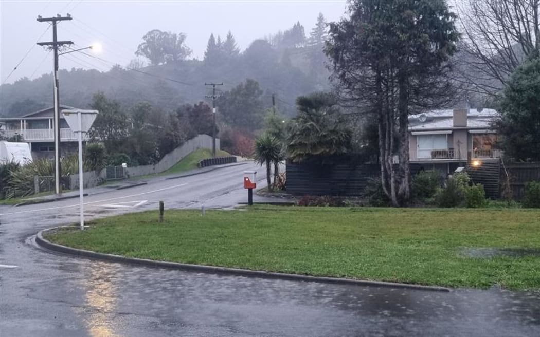 Water pooling on Eighty Eight Valley Road in Wakefield as rain arrives in the Nelson-Tasman region.