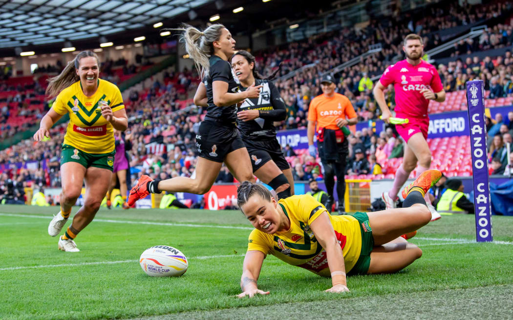 Australia'a Isabelle Kelly scores her first try against New Zealand in the women's Rugby League World Cup final at Old Trafford.