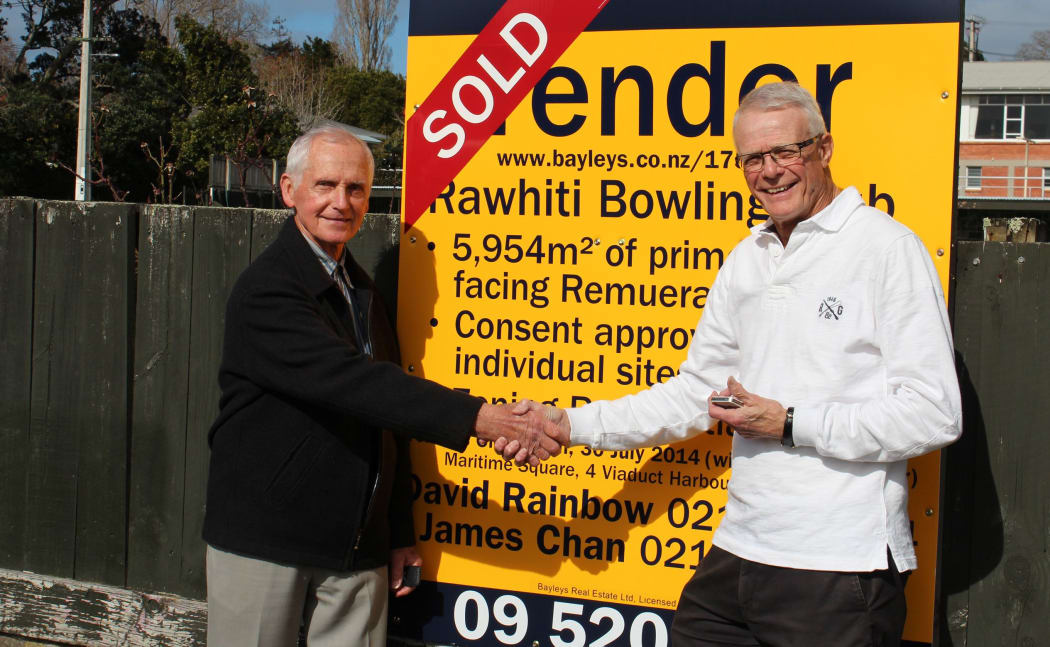 Rawhiti Bowling Club vice president Jim Mclean, left, and president Rod College at the end of the sales process.