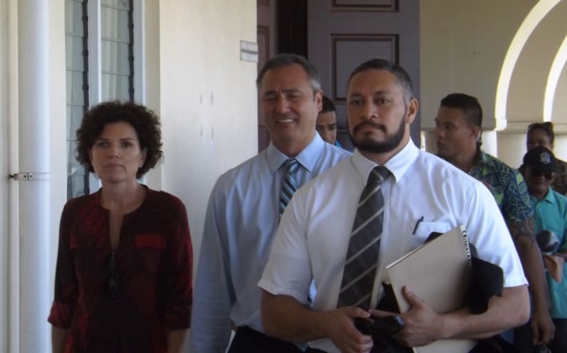 Police Commissioner, Fuiavailili Egon Keil, in the middle heading to court with his lawyer (right) a family supporter and civilian police officers behind.