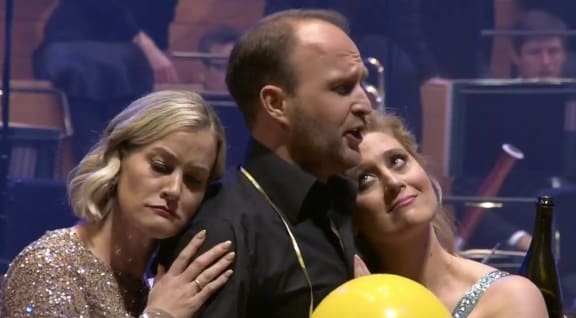 Brigitte Heuser, Richard Šveda and Julie Lea Goodwin from the party scene from Act 2 of the Auckland Philharmonia's performance of Die tote Stadt
