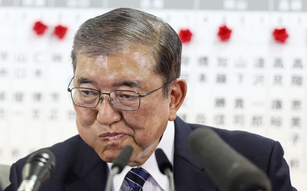 Japan's Prime Minister Shigeru Ishiba reacts during an interview with local media at the Liberal Democratic Party (LDP) headquarters as results in the country's general election are released, in Tokyo on October 27, 2024. - Japan's scandal-hit ruling party fell short of a majority for the first time since 2009 in snap elections on October 27, media projections showed, a blow to new Prime Minister Shigeru Ishiba. (Photo by JIJI PRESS / AFP) / Japan OUT / JAPAN OUT