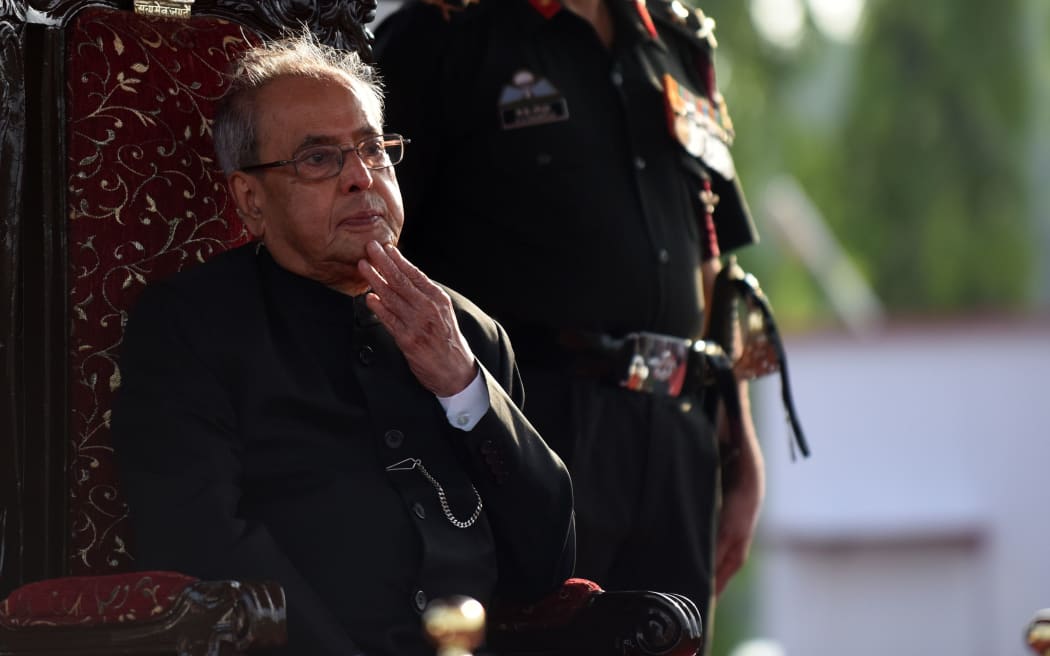 In this file photo taken on September 10, 2016 then-president Pranab Mukherjee reviews a passing out parade of cadets during their graduation ceremony at the Officers Training Academy in Chennai.