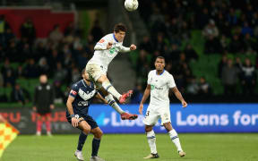 Hiroki Sakai of Auckland FC heads the ball.