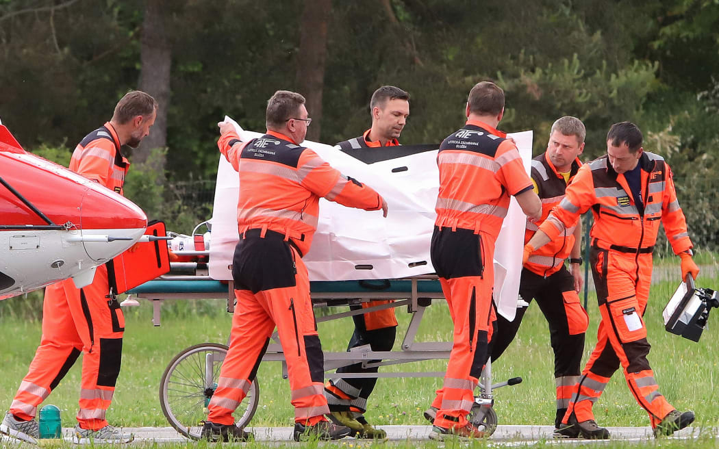 Picture taken on May 15, 2024 shows Slovak Prime Minister Robert Fico being transported from a helicopter by medics to the hospital in Banska Bystrica, Slovakia where he is to be treated after he had been shot "multiple times" (Photo by AFP) / ALTERNATIVE CROP