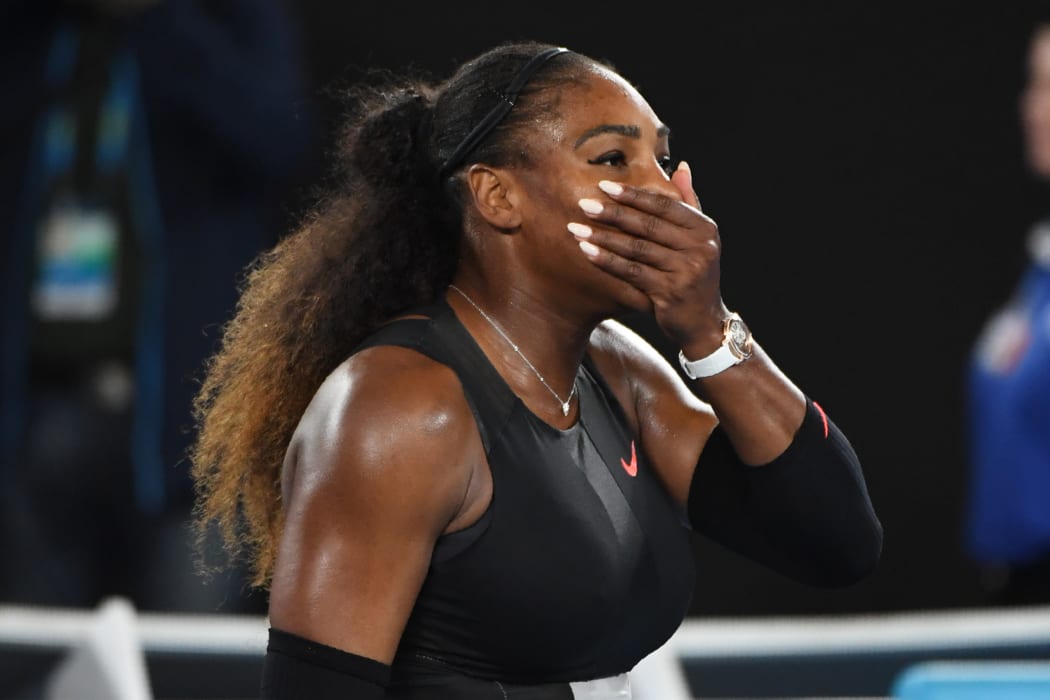 Serena Williams has won a record-breaking 23rd grand slam title at the Australian Open, beating her sister Venus 6-4 6-4.