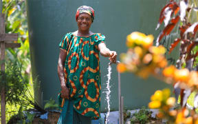 Mrs Kausa, a teacher at the Bialla Primary School, is one of 5,000 people now accessing clean running water following a World Bank-supported project