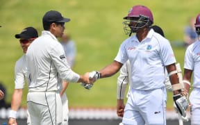 West Indies' Shannon Gabriel shakes hands with New Zealand's Ross Taylor after New Zealand's win during day four of the first Test cricket match.