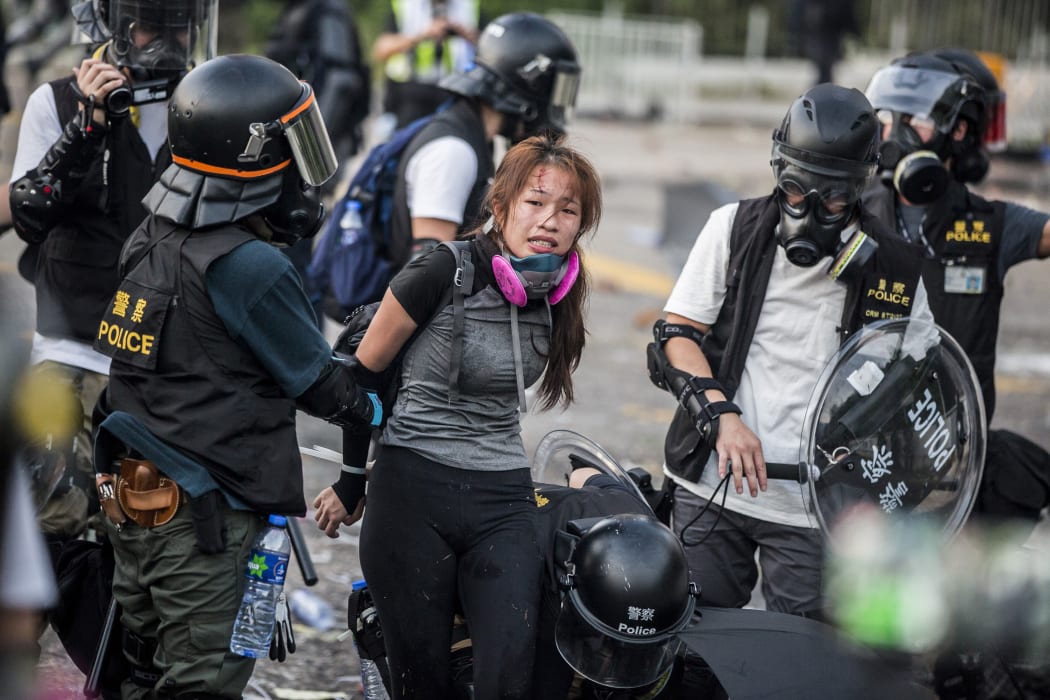 Police detain demonstrators in the Sha Tin district of Hong Kong as violent demonstrations take place in the streets of the city on the National Day holiday to mark the 70th anniversary of communist China's founding.