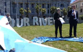 The irrigation petition is presented to David Parker and Eugenie Sage.