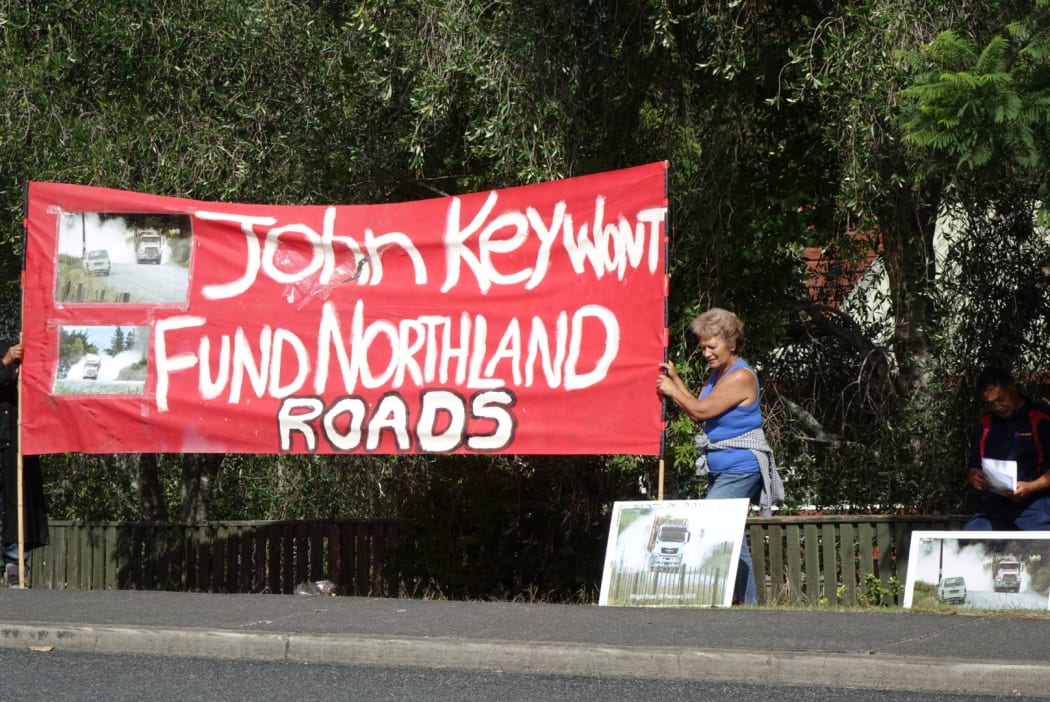 Members of the Pipiwai-Titoki rural roads advocacy group outside Northland Polytechnic in Kerikeri, during a speech by Prime Minister John Key.