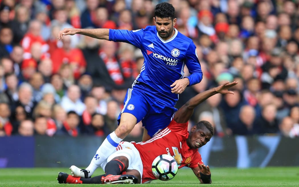Diego Costa is tackled by Manchester United's Paul Pogba
