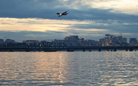 Southwest Airlines Boeing 737-700 aircraft as seen landing at dusk time at Ronald Reagan Washington National Airport DCA in Arlington County, Virginia over the Potomac River in the United States of America flying over water and buildings. The arriving B737 passenger airplane has the registration tail number N750SA and is powered by 2x CFMI jet engines. Southwest airline is the world's largest low-cost carrier with headquarters in Dallas Texas a fleet size of 793 planes. Washington DC, USA on May 2023 (Photo by Nicolas Economou/NurPhoto) (Photo by Nicolas Economou / NurPhoto / NurPhoto via AFP)