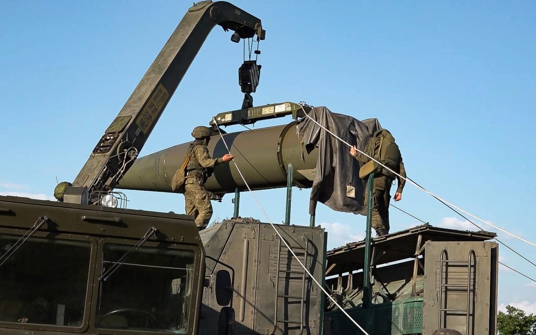 In this photo released by Russian Defense Ministry Press Service on Tuesday, May 21, 2024, Russian troops load an Iskander missile as part of drills to train the military for using tactical nuclear weapons at an undisclosed location in Russia. Russia's Defense Ministry on Tuesday said it began the first round of drills involving tactical nuclear weapons. It was the first time Russia has publicly announced drills involving tactical nuclear weapons, although its strategic nuclear forces regularly hold exercises. (Russian Defense Ministry Press Service via AP)