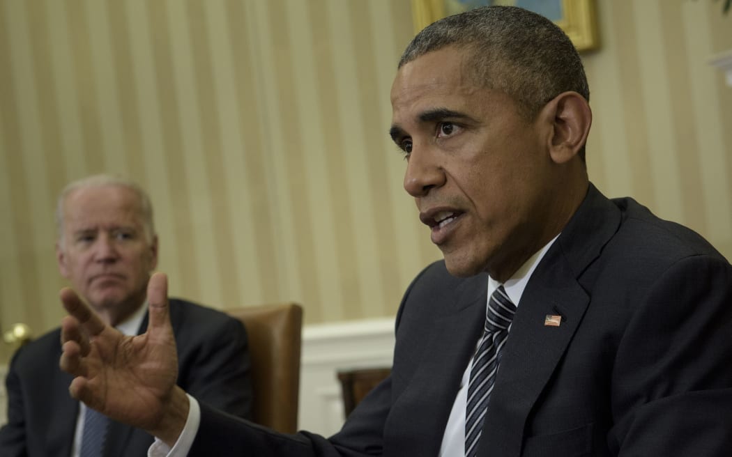 US Vice President Joe R. Biden (L) listens as US President Barack Obama speaks after a meeting about the Zika virus in the Oval Office of the White House on May 21, 2016 in Washington, DC.