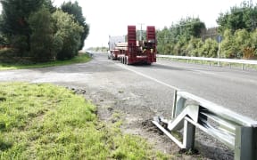 A truck rumbles along SH57 near Levin, with the new barriers on both sides of the road.