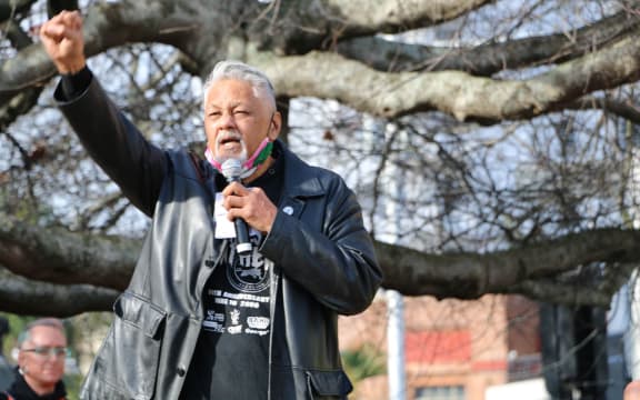 Will 'Ilolahia of the Polynesian Panthers raises his fist along with protesters as he speaks at the Black Lives Matter rally in Auckland's Aotea Square on 14 June, 2020.