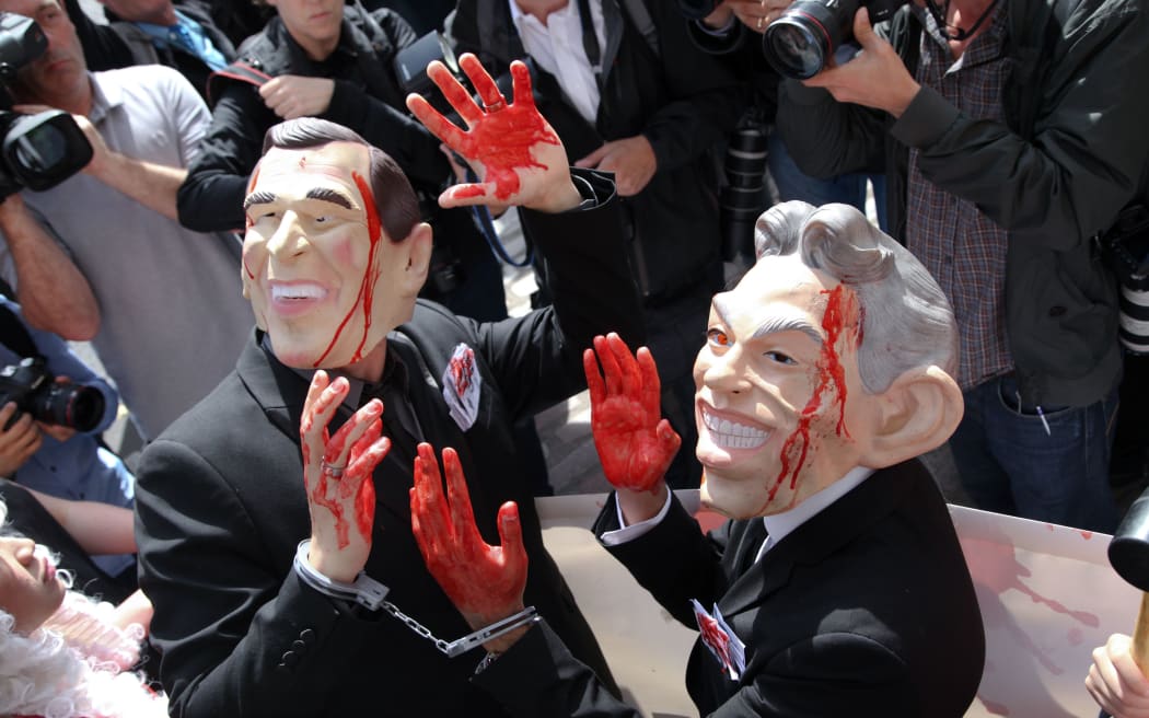 Anti-war protesters rally in central London as the Chilcot inquiry is released.