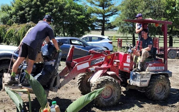 Black Caps bowler Blair Tickner (driving) and others help out with recovery efforts in Hawke's Bay in the wake of Cyclone Gabrielle.