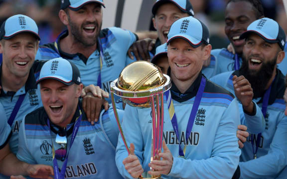 England's captain Eoin Morgan lifts the World Cup trophy as England's players celebrate their win after the 2019 Cricket World Cup final between England and New Zealand