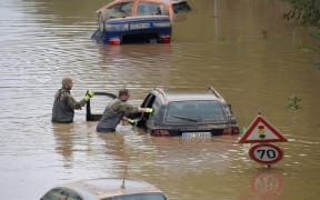 Soldiers of the German armed forces Bundeswehr search for flood victims in submerged vehicles on the federal highway B265 in Erftstadt.