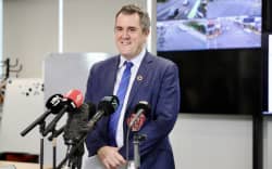 Transport Minister Chris Bishop making an announcement in Auckland