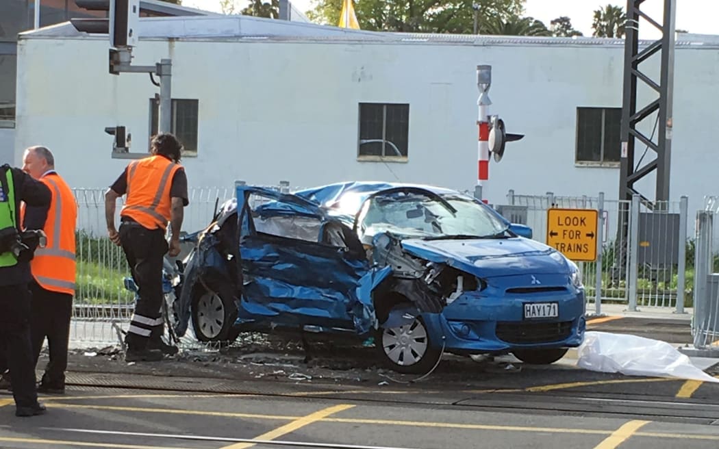 The woman's car was extensively damaged after colliding with the train.