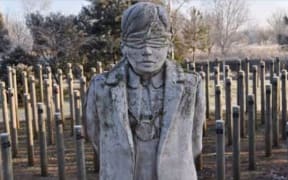 The Shot at Dawn Memorial features a statue of a blind-folded man with his hands tied behind his back waiting to be executed by firing squad.