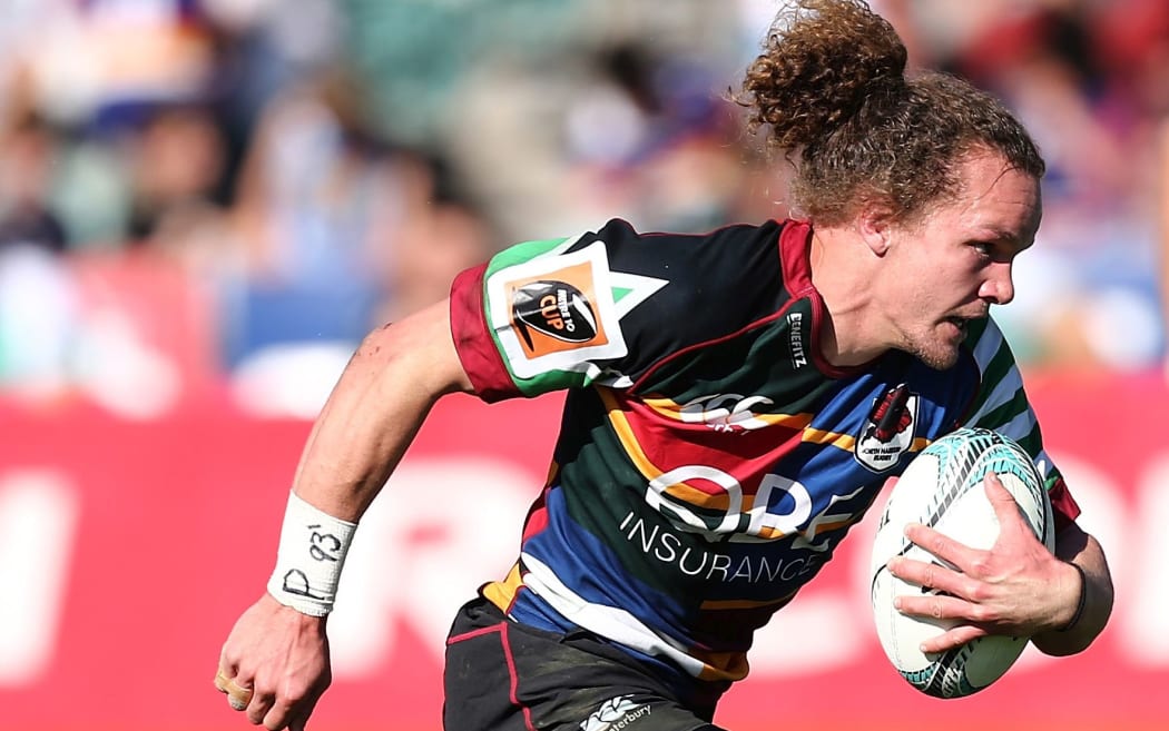 Harbour's Michael Little runs in a try.