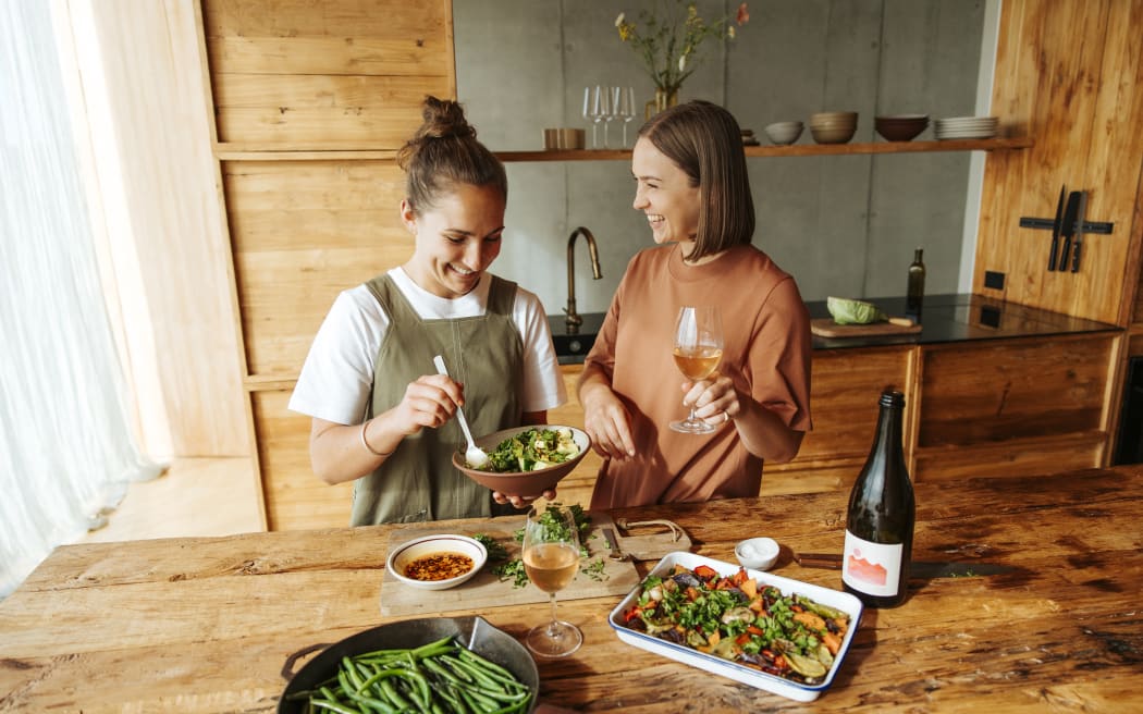 Rosa (left) and Margo (right) eating at bench.