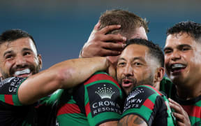 Benji Marshall celebrates with his Souths teammates.