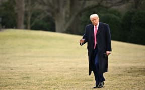 US President Donald Trump walks to the White House in Washington, DC, on 22 February, 2025 after addressing the Conservative Political Action Conference (CPAC). (Photo by Mandel NGAN / AFP)