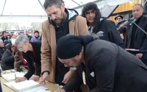 Iwi negotiators sign a Deed of Settlement between iwi collective Te Korowai o Wainuiārua and the Crown at Raetihi Marae in July last year. Photo: Robert Milne. Single use image