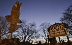 Gore's iconic brown trout statue and welcome sign were defaced overnight.